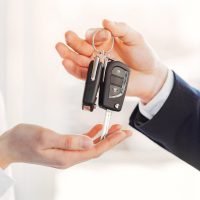 Stylish and elegant woman in a car salon Woman buying the car. Lady in a car salon. Manager with a client